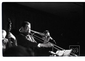 Trombonist and bassist playing.