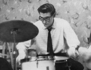 Man playing drum kit