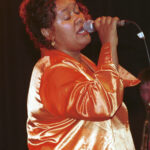 Woman singing.