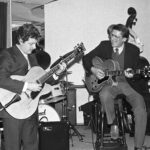 Two jazz guitarists in concert.