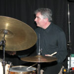 Man playing drums.