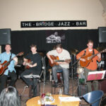 Quartet of jazz guitarists.