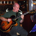 Man playing guitar.