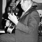 Man playing guitar.