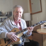 Man playing guitar.