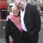 Portrait of woman and man on street