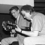 Two jazz guitarists in concert.