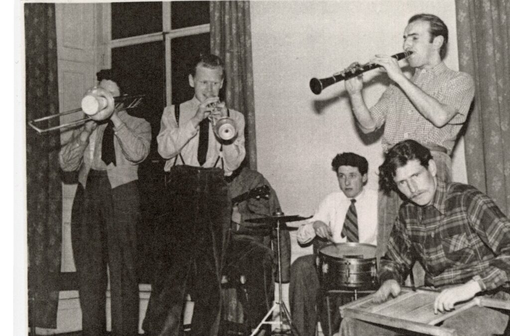 Six men playing jazz.