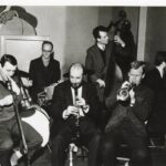 Six men playing jazz.